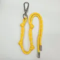 Vibrant yellow braided cord bag charm with silver carabiner and adjustable knots. - Yellow