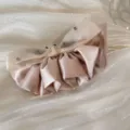 Close-up view of a champagne satin and organza ruffled hair clip with crystal accents - Bow Banana Clip / Beige Mesh Ruffle Banana Clip