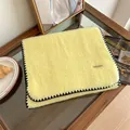 Detail of pale yellow mohair scarf with black whipstitch edges and soft cashmere texture. - 160cm / Milk Yellow