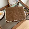 Detailed view of brown mohair scarf with white whipstitch edging and soft texture - 160cm / Brown