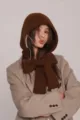 Detailed close-up of a brown knitted balaclava hood with an integrated winter scarf - One Size / Coffee