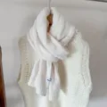 Close-up of white knitted wool scarf with detailed texture and small brand tag - White / 170cm