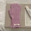 Women's stylish pink cable-knit wool gloves featuring a decorative ribbed cuff label - One Size / Purple