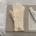 Eleganti guanti in lana a trecce crema da donna per un calore invernale sobrio - Taglia unica / Bianco