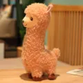 Cute plush llama alpaca toy in curly apricot faux fur standing on wooden table - Brown / 33cm
