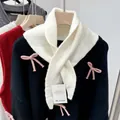Elegant white wool blend knitted triangle scarf paired with a black bow sweater variant - Cream