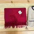 Detail of a 100% Australian wool scarf in deep burgundy with elegant fringe tassels - Burgundy