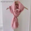 Macro view of Morandi pink lightweight linen-feel shawl on wooden hanger for travel - 180cm / High-end Pink