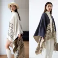 Stylish women's oversized geometric poncho shawl with fringe detail in cream and navy. - Milan Rhombus