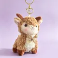 Cute brown plush goat keychain accessory with a striped gold bow tie decoration - Brown Sheep (Xinjiang Sheep) / 12cm / Brown Bowknot