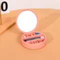 Boîte à bijoux rose ronde portable avec miroir intégré et plusieurs compartiments - Rond / 10x3cm / Rose