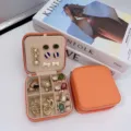 Boîte à bijoux portable orange à double couche pour le rangement des boucles d'oreilles et bagues - Orange