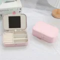 Portable pink PU leather jewelry organizer box with built-in mirror for rings and earrings - Sakura Pink