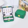 Tragbares grünes Schmuckkästchen aus PU-Leder für die Reise mit elegantem Goldverschluss - 13.5x11.5x5.2cm / Schwarzer Rand Grün