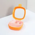 Boîte à bijoux compacte en silicone orange avec miroir intégré et intérieur rose - Orange