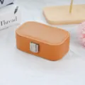 Portable orange faux leather jewelry storage box for travel with metal clasp - PU Leather Snap Button Style / Coffee