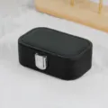 Portable black travel jewelry storage box with Saffiano texture and silver metal clasp - Cross Grain Snap Button Style / Black