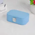 Light blue portable jewelry travel box in textured synthetic leather with silver clasp - Cross Grain Snap Button Style / Light Blue