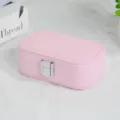 Portable pink travel jewelry box with textured PU leather finish and secure silver clasp - Cross Grain Snap Button Style / Sakura Pink