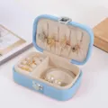 Premium portable light blue travel jewelry organizer box for rings and necklaces storage - PU Leather Snap Button Style / Light Blue