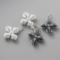 Detailed view of 925 sterling silver vajra pendants in shiny and antique finishes. - Plain White