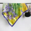Detail view of a 90x90cm square silk scarf featuring a vibrant purple iris oil painting - RY-20