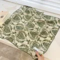 Detailed view of vintage green damask floral cotton scarf with scalloped lace edges. - 68cm / Rice Green Branches
