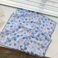 Detailed view of a 100% cotton square scarf featuring a blue heart pattern and navy lace trim - 68cm / Blue Cartoon Hearts