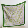 Detailed view of a 90x90cm square silk scarf with lavender floral and green patterns. - RY-38