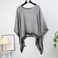 Detail view of the elegant grey patterned sheer poncho for women's beachwear. - Style 11