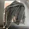 Detailed view of a black French style scarf with tweed trim and pearl pendants - 68cm / Black