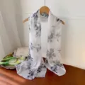 Elegant white long georgette scarf with grey floral print on a wooden hanger - Black & Gray Peony / 160cm