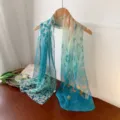 Elegant teal and orange floral gradient georgette long scarf displayed on a wooden hanger - Lake Green Leaf / 160cm
