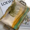 Elegant floral print georgette silk scarf featuring yellow and green tones on a golden tray - Multicolor Grass Green Floral / 160cm