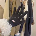 Close-up of black knitted touch screen gloves with plush lamb wool cuff - One Size / Classic Black