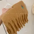 Close-up of thick camel wool blend scarf with cute girl embroidery and long tassels - Embroidered Girl / Camel