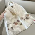 Detail of elegant silk blend scarf with colorful floral embroidery and subtle glitter - 180cm / Beige