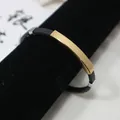 Minimalistisches schwarzes Silikonarmband mit gravierbarer goldener Edelstahlplatte - Gold