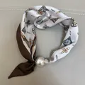 Elegant brown and champagne silk scarf featuring a large pearl slide buckle detail - Khaki Feather / 47cm