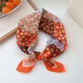 Vintage floral print silk square scarf tied in a stylish decorative neckerchief knot - Geometric Orange Block
