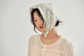 Detailed view of a vintage-style floral cotton headscarf with yellow and green print - Light Green Small Floral / 58*58cm