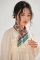 Detail of a vintage floral print square scarf styled around the neck in a retro fashion look. - Coffee Floral / 58*58cm