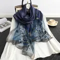 Premium navy blue silk wool scarf featuring intricate floral embroidery and beadwork - Sapphire Blue