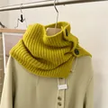 Detailed view of vintage mustard yellow knit neck warmer with black button closure. - One Size / Yellow