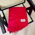 Elegant red solid color cashmere-like scarf featuring soft fringe and brand label detail - 38-180cm / New Year Red