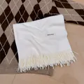 Cozy soft white winter scarf featuring a classic solid color with fringe tassel details - White