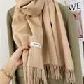 Elegant beige solid color winter scarf for women with soft tassel trim and woven label - Camel