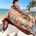 Elegant ethnic pomegranate print beach shawl scarf for women featuring floral brown borders. - 1