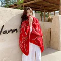 Red ethnic style shawl with white floral embroidery and bohemian travel vibe. - Red with White Flowers