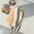 Elegant pleated 90cm square scarf featuring orange houndstooth and grey striped patterns - 90cm / Ivory Houndstooth